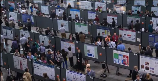  - We will be standing next to our posters like this.