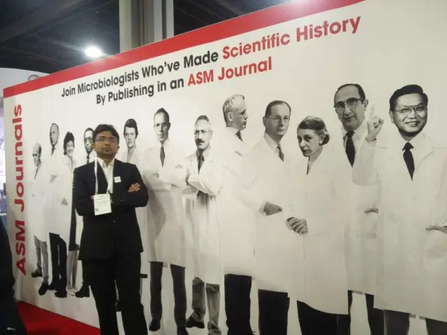 Tankeshwar Acharya in the stall of ASM Journal - Joining with Microbiologists who’ve made scientific history by publishing in an ASM Journal
