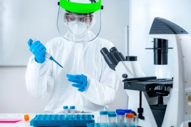 Microbiologist working in a lab - Microbiologist working in a lab